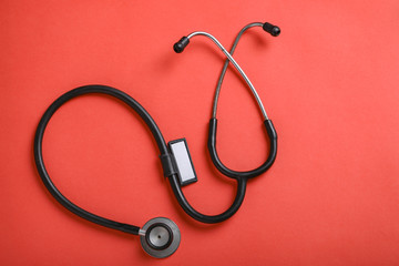 stethoscope on red background