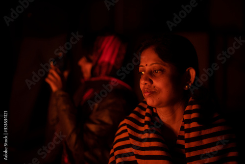 A Cheerful Indian Bengali Brunette Family In Winter Wear Enjoying Bonfire On Rooftop In The Evening Indian Lifestyle And Winter Wall Mural Abir