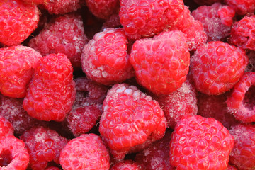 Fresh frozen raspberries. Close-up. Background. Texture.