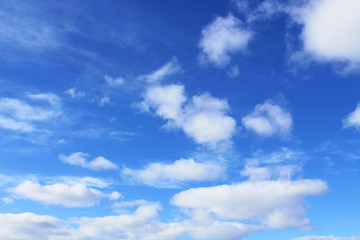Beautiful blue sky and white cumulus and cirrus clouds. Background. Scenery.