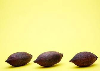 Cocoa pods on a yellow background,