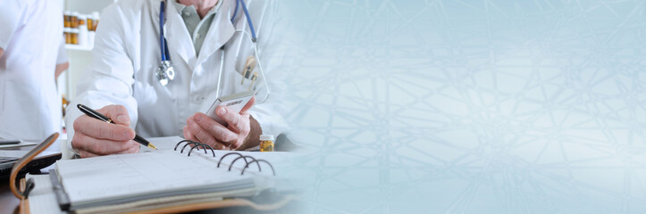 Doctor holding a smartphone and taking notes; panoramic banner