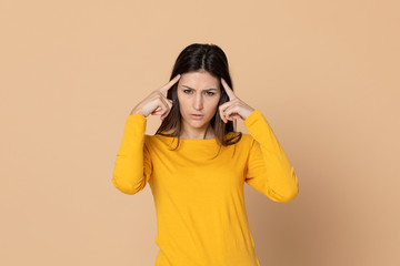 Attractive young girl wearing a yellow T-shirt