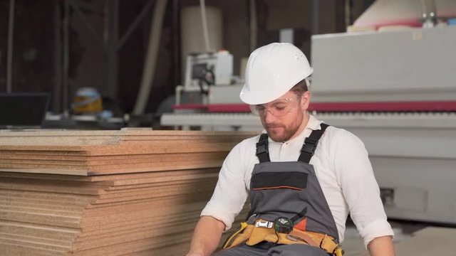 a worker in a casket is screaming and angry at him