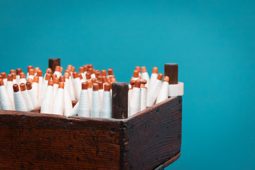 Close up shot of old sewing machine, white textile fabrics, wooden structure. Old fashioned times, retro and vintage concept fot the clothing industry.
