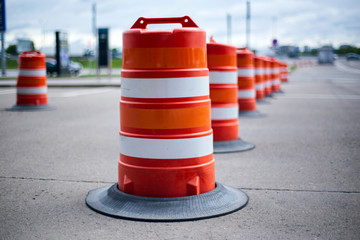 traffic barrier barrels in the parking lot