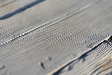 Natural gray wooden planks of a walking path
