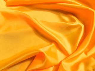 Obraz premium Minimal yellow fabric texture background. smooth elegant wavy light with cpoy space