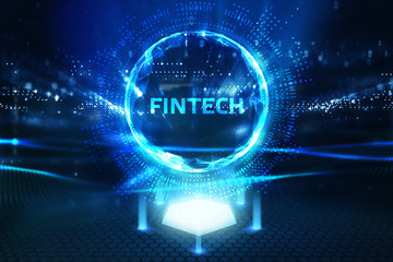 Fototapeta premium Fintech -financial technology concept.Young businessman select the icon Fintech on the virtual display.