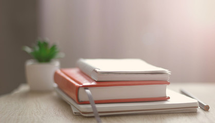 Workplace. Books, notebooks on the table opposite the window. Telework. Work at home.