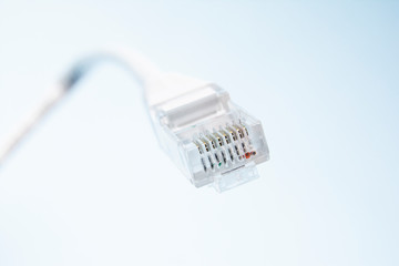 Connector rj-45. White transparent connector rj45 for network and internet. Close-up macro on a...