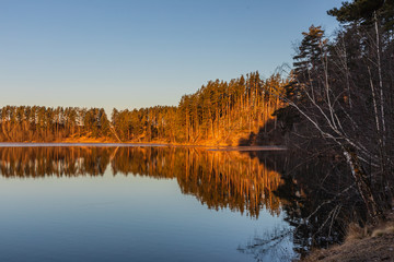 Beautiful landscape of morning dawn on a forest lake.