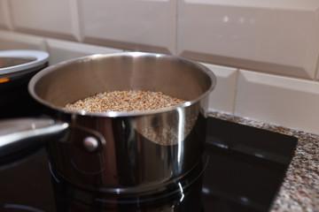 grits buckwheat in a saucepan and butter