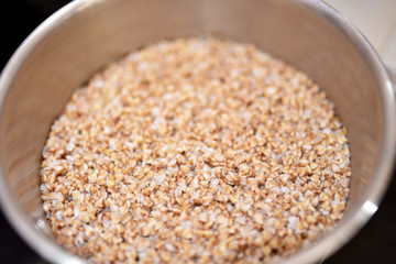 grits buckwheat in a saucepan and butter