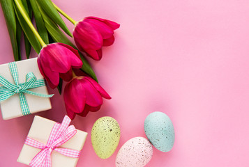 Obraz na płótnie Canvas Decorative Easter eggs and tulips