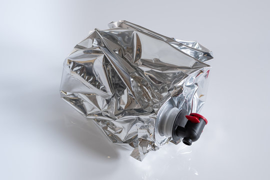Crumpled plastic wine bag on white background