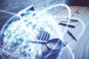 Double exposure of business theme icons and work space with computer background. Concept of success.