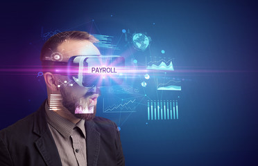 Businessman looking through Virtual Reality glasses with PAYROLL inscription, new business concept