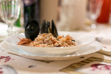 Close Up of Italian Traditional recipe claled Seafood Risotto, made with rice and Fish