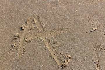 Sand drawing in the beach