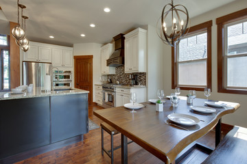 An absolute beautiful luxury living room with huge vaulted  ceiling, fire place, harwood floor, amazing furniture, and lots of windows and doors.