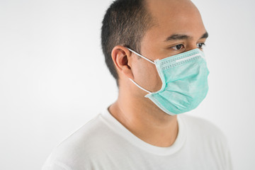 The young man had a cold and a fever. He wearing  protection mask. coronavirus or covid 19 concept.