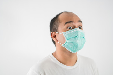 The young man had a cold and a fever. He wearing  protection mask. coronavirus or covid 19 concept.