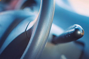 Steering wheel in interior of a new car.