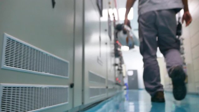 Engineering walking in electrical substation building, Blurred video