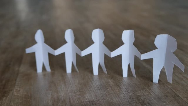 Paper cut business teamwork on the floor