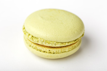 Green macaroni Cookies on a white background, isolated.
