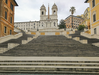 Fototapeta na wymiar Following the coronavirus outbreak, the italian Government has decided for a massive curfew, leaving even the Old Town, usually crowded, completely deserted. Here in particular the Spanish Steps