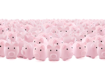 Large group of pink piggy banks on white background