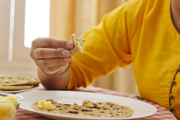 Woman Eating Breakfast
