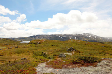 Snowy mountains and blue cold sky at Norwegian fjord coast