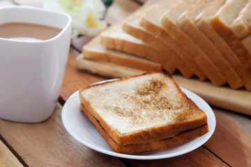 Fototapeta na wymiar Toasted white bread with cup of tea 