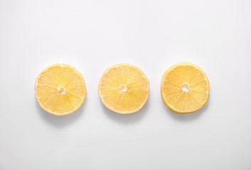 Slices of lemon on white background