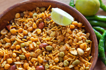 Close-up of fried mixture in a bowl with slice of lemon
