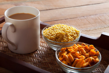 Mug of tea with snacks
