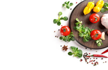 Vegetables on wooden board on white wooden background