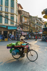 Fototapeta na wymiar Street vendor in old quarter in Hanoi