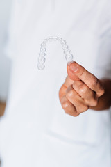 People in a dental lab working in the fabrication process of dental transparent aligners