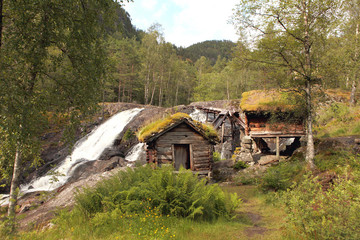 Very old watermills with grassy roofs in Norway