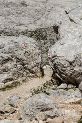 Two red trail blaze on two rocks
