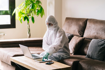 A woman with great security measures against a virus works from home
