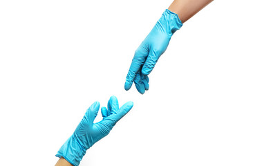 Hands of people in medical gloves reaching out for each other on white background.