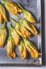 Fresh zucchini flowers (Fiori di zucca) with  drops of water, close-up, selective focus. Interesting South Italian Cuisine Ingredients