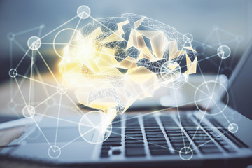 Double exposure of table with computer and brain hologram. Data innovation concept.