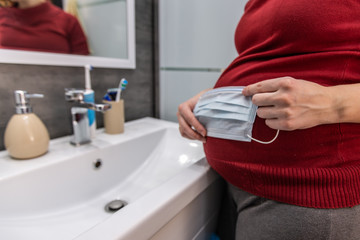 Coronavirus pandemic prevention wash hands with soap warm water and , rubbing nails and fingers washing frequently or using hand sanitizer gel. Pregnant