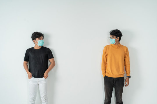 social distancing. people with masks keep their distance during virus symptoms